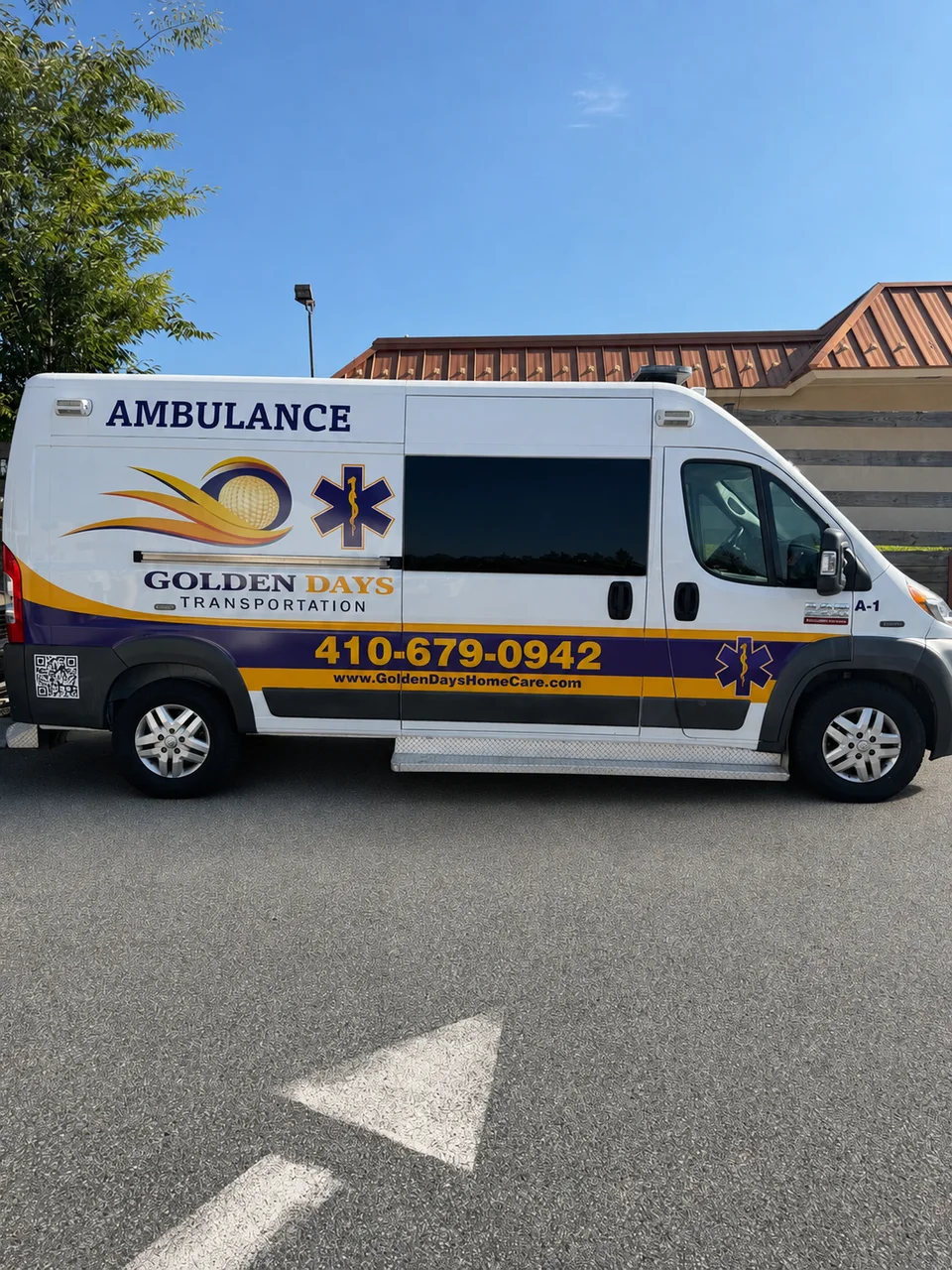 Side view of the Golden Days ambulance with purple and gold branding